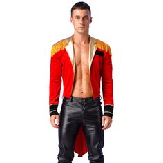 a man in a red jacket and black pants is posing for the camera with his shirt open