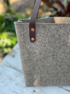 Pure wool, thick, natural, sturdy, premium quality felt tote bag with leather straps! Perfection. Simple and easy. A timeless classic. Natural beauty. Measures 14" in height, 12" wide at the base, 16" wide at the top/opening of the bag, with a 5.5" gusset (depth), and a drop length of 12" from the shoulder. Daily Use Wool Tote Bag, Daily Use Wool Bags With Leather Handles, Daily Use Wool Bag With Leather Handles, Eco-friendly Canvas Shoulder Bag With Leather Handles, Everyday Felt Tote Bag, Minimalist Shoulder Bag, Felt Tote Bag, Felt Tote, Wool Bags