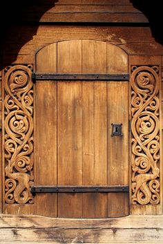 an old wooden door with intricate carvings on it