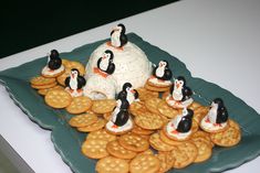 a plate with crackers and penguins on it