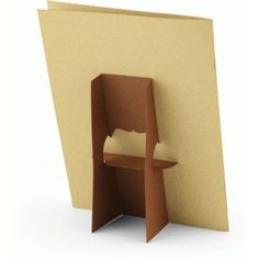 an open book with a chair in the corner and paper on it's back