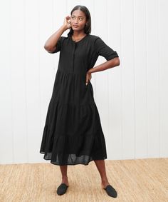 James Dress Black We gave the James Dress a slight update—now with a new, longer fit, this is the dress you don't want to miss. This lightweight cotton linen dress is modeled after its namesake top, making it easy, billowy, and ultra-comfortable as can be. 88% cotton, 12% linen. Made in China. Hits just above the ankle. Tiers make for a relaxed feminine fit that's easy to wear anywhere. | Jenni Kayne James Dress Size Medium Jenni Kayne Dress, Jenni Kayne, Cotton Linen Dresses, The James, Feminine Silhouette, Tiered Maxi Dress, Tiered Dress, Large Size Dresses, Linen Dress