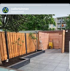 a wooden fence with some plants in it