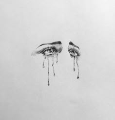 a drawing of two eyes with tears coming out of them