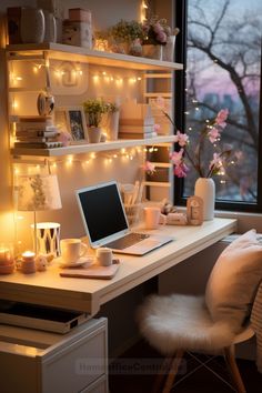 a laptop computer sitting on top of a desk next to a window with fairy lights