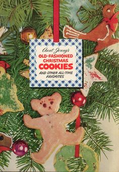 an old fashioned christmas ornament with cookies and other holiday decorations hanging from it