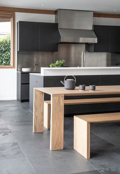 the kitchen is clean and ready to be used for cooking or eating, with no one in it