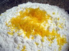 a bowl filled with flour and orange zest