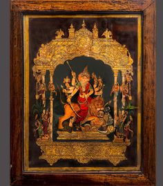 a painting on display in a wooden frame with an image of the hindu god riding a horse