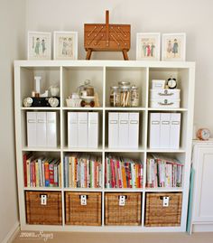 the bookshelf is filled with lots of books and other things to put on it