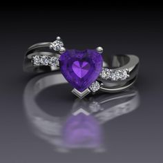 a purple heart shaped ring with diamond accents