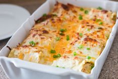 a casserole dish with cheese and green onions