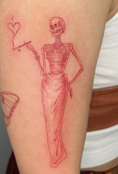 a woman with a skeleton tattoo on her arm