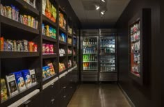 a grocery store filled with lots of food and drink coolers next to each other