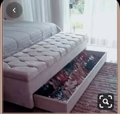 a bed that has some shoes in it