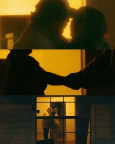 two people standing in front of a window holding hands and kissing each other with the sun shining on them