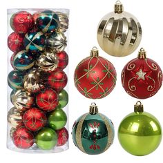 assorted christmas ornaments are in a clear box on a white background, including red and green baubles