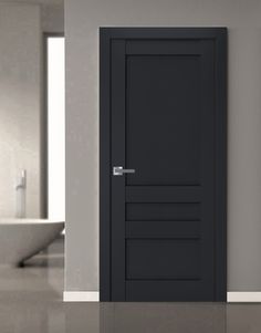 an empty bathroom with a black door in it