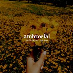 a person holding flowers in their hand with the words ambrosial above them