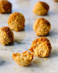 several balls of food on a marble surface