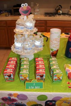 the sesame street birthday party is complete with water bottles, cups and candy bar wrappers