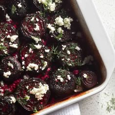 beets, feta cheese and herbs in a casserole dish