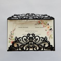 an ornate black and white wedding card holder