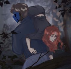 two people are hugging in the woods