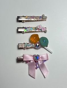 ✨ Kawaii Candy Hair Clips | Cute Fairy Kei Pastel Barrettes | Mix & Match Custom Hair Clip Set. This listing is for either a single clip or a custom set based on availability. Each piece is made with a combination of epoxy resin and polymer clay embellishments as well as satin bows. ✨Each item is hand made and adhered one piece at a time. Although I use my own version of forever glue these should be handled with care to avoid damage.  These items are made up of small parts that could be a choking hazard if item is damaged. ✨ 1.5 inch (3.81cm)  ✨Shipping & Delivery ~ Your order is made and ready to ship in 1-3 business days ~ Packages are typically shipped via USPS ✨KEEP SHOPPING  Return to my main shop here:  https://www.etsy.com/shop/LemonPopLolita Find similar items here: https://www.ets Candy Hair Clips, Diy Hairclips, Clay Embellishments, Clay Hair Clips, Hair Clips Cute, Pastel Fairy, Kawaii Candy, Resin And Polymer Clay, Clay Hair