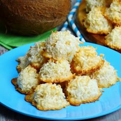 coconut cookies on a blue plate next to a coconut