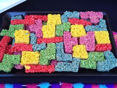 colorful rice krispy treats are on a tray