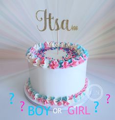 a white cake with pink and blue sprinkles on it that says usa boy or girl?