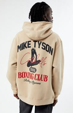 Embrace the spirit of the ring with the Mike Tyson Boxing Club Hoodie. This hoodie features an adjustable drawstring hood, long sleeves, a relaxed fit, a kangaroo pocket, and "Property of Tyson Boxing Club" graphics printed on the front and back, making it a perfect choice for those who appreciate the world of boxing.   	Adjustable drawstring hood 	Long sleeves 	Relaxed fit 	Kangaroo pocket 	Front & back graphics 	100% Cotton 	Machine washable 	Model is wearing a large 	Model Measu Mike Tyson T Shirt, Mike Tyson Boxing, Graphic Clothes, Graphic Shirt Design, Minimalist Streetwear, Retro Graphic Design, Miami Gardens, Boxing Club