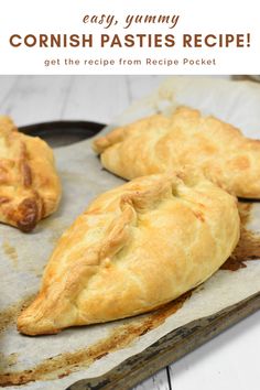 two pastries sitting on top of a piece of parchment paper next to each other