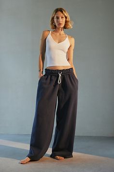 Out From Under sweatpant made special with piping details. Designed in a relaxed wide-leg silhouette featuring a ruffled elastic waistband with drawstring tie, side pockets and split hems. Exclusively at Urban Outfitters. Features Out From Under Hoxton piping wide leg sweatpant Wide leg sweatpant Soft and stretchy knit Ruffled elastic waistline with drawstring tie Side pockets with contrast piping down the sides Split hems Relaxed wide-leg fit Full length Easy pull-on style UO exclusive Content + Care 69% Cotton, 31% polyester Machine wash Imported Size + Fit Model in Ivory is 5’8" and wearing size Small Measurements taken from size small Inseam: 30" | Out From Under Hoxton Piping Sweatpant in Navy, Women's at Urban Outfitters Wide Leg Sweatpants Outfit, Urban Outfitters Sweatpants, Sweats Aesthetic, Dance Sweatpants, Sweatpants Wide Leg, Navy Sweatpants, Cute Sweats, Loose Sweatpants, Cute Sweatpants