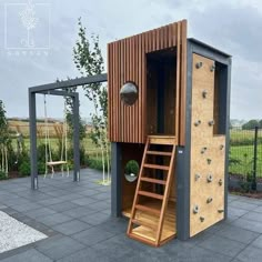 an outdoor sauna with stairs and climbing wall