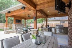 an outdoor kitchen and dining area is shown