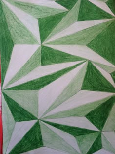 a green and white drawing on paper that looks like it has been made with colored pencils