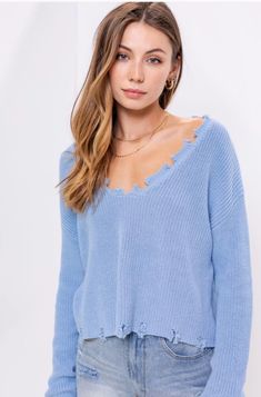 Cooler weather is here and you'll be ready for it in the Bright Star Light Blue Distressed V-Neck Sweater! Soft cotton knit shapes this must-have sweater with a distressed V-neckline, long sleeves, and a relaxed, slightly cropped bodice. Pair this sweater top with high-waisted jeans and boots for the perfect cool-weather look! Fringe V-neck Top For Fall, V-neck Fringe Top For Fall, Atascadero California, Indigo Clothing, Ripped Sweater, Distressed Sweater, Distressed Sweaters, Bright Star, Star Light