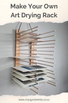 a rack that has books on it with the words make your own art drying rack