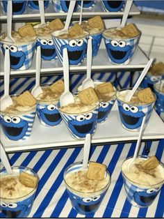 there are many ice creams with cookie cookies on them and spoons in the cups