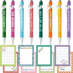 several different colored pens and notepads with writing on the top one is blank