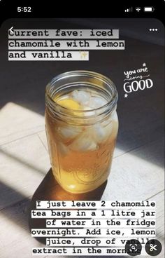 a jar filled with lemonade sitting on top of a table