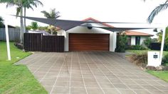 a house with a large driveway in front of it