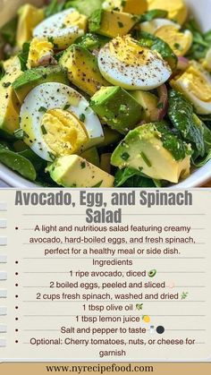 a salad with eggs, spinach and avocado in it on a table