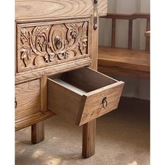 a wooden dresser with an open drawer