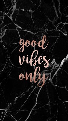 the words good vibes only written in gold on a black marble background with pink ink