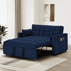 a living room scene with focus on the blue couch