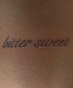 the word butter sweet written in cursive writing on a woman's back