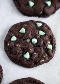 chocolate cookies with white and green candies on top